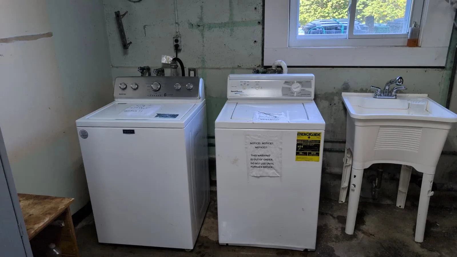 Washer, dryer, and utility sink in a home laundry service area.