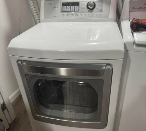White front-load dryer ready for appliance service in Staten Island.
